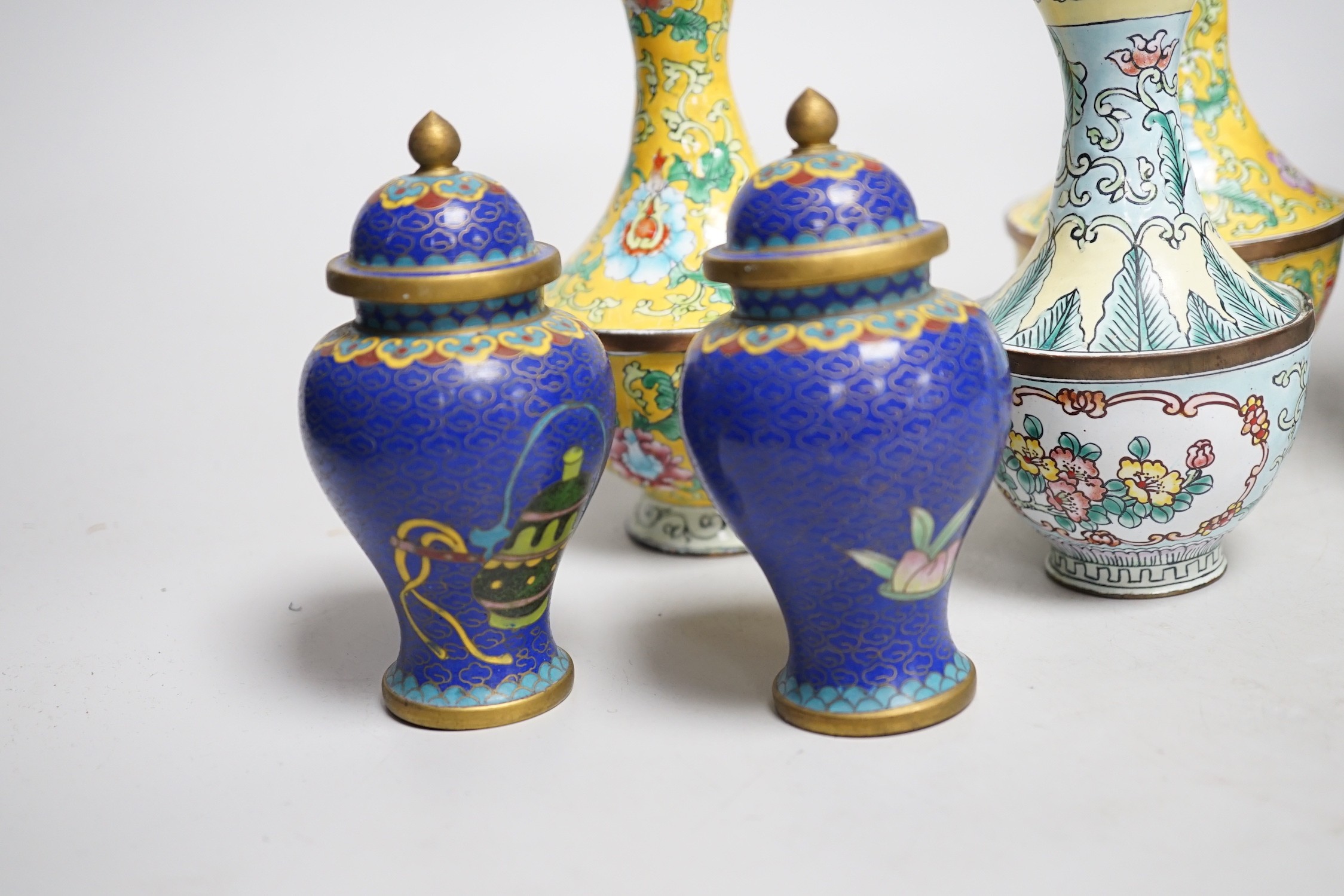 A group of Canton enamel vases, a pair of cloisonné enamel jars and a blue and white jar. Tallest 15.5cm